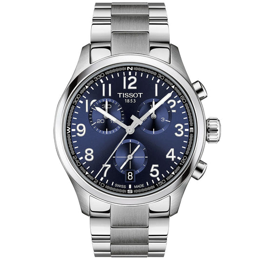 The Tissot CHRONO L Quartz 42mm Watch features a stainless steel build, blue dial with white numerals, three subdials, date at 4 o’clock, metal link bracelet, and Swiss quartz technology for precise timekeeping.