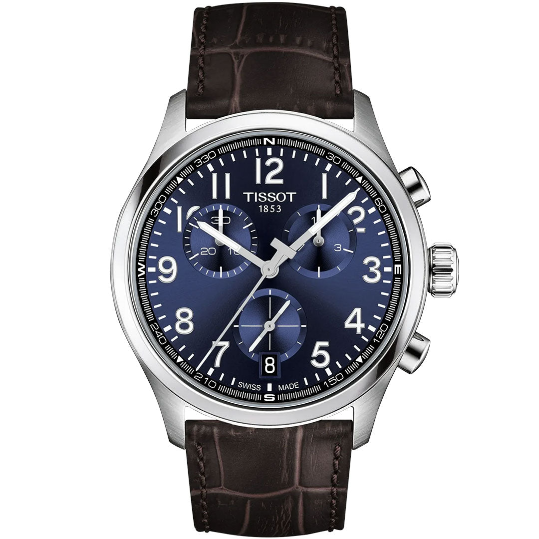 The Tissot CHRONO L Quartz 42mm watch by Tissot features a blue dial with white numerals, silver-tone case, Swiss quartz movement, three subdials, and a brown leather strap with crocodile pattern. The time displayed is 1:53:13.