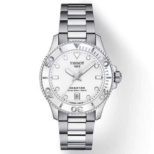 The Tissot Seastar 1000 Quartz 36mm Watch showcases a silver stainless steel case and bracelet, a white dial with luminescent markers, and a date display positioned at 6 o'clock. It is driven by Swiss quartz movement and features a scratch-resistant sapphire crystal for longevity, while offering water resistance up to 300 meters.