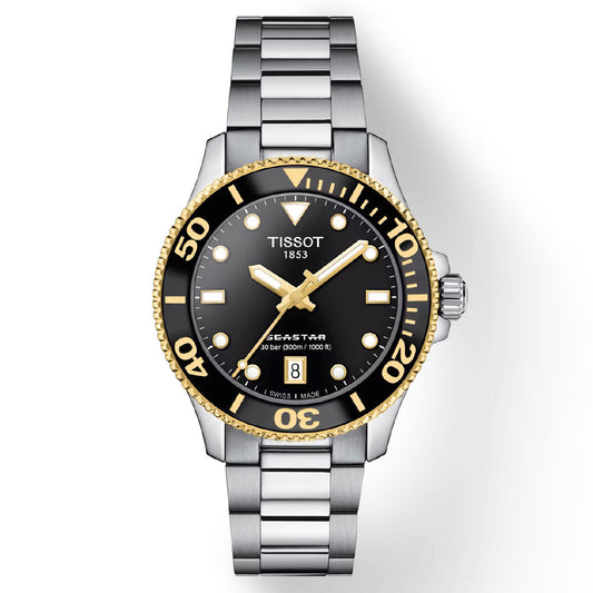 The Tissot Seastar 1000 Quartz 36mm Watch showcases a stylish silver design with a 36mm case, complemented by a black dial and gold bezel. This timepiece includes silver and gold hour markers, luminescent hands, and a date window positioned at 6 o'clock. Featuring Swiss Quartz Movement, it is safeguarded by a sapphire crystal. The watch also boasts a brushed finish on its stainless steel bracelet for an elegant touch.