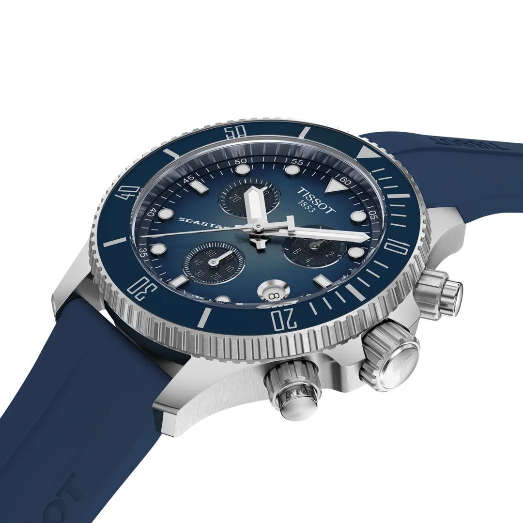 A Tissot Seastar 1000 Quartz 38mm Watch by Tissot, shown at an angle on a white background, showcases a striking blue gradient dial with Seastar design elements, three chronograph subdials, a stainless steel case, and a blue rubber strap.