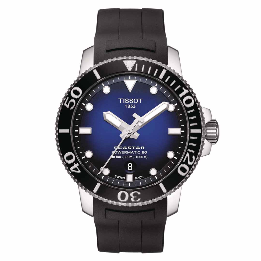 The Tissot Seastar 1000 Powermatic 80 Automatic 43mm Watch from Tissot showcases a blue gradient dial and a ceramic bezel with silver accents, driven by the Powermatic 80 automatic movement. This timepiece includes a date display at the 6 o'clock position and is paired elegantly with a sleek black rubber strap.