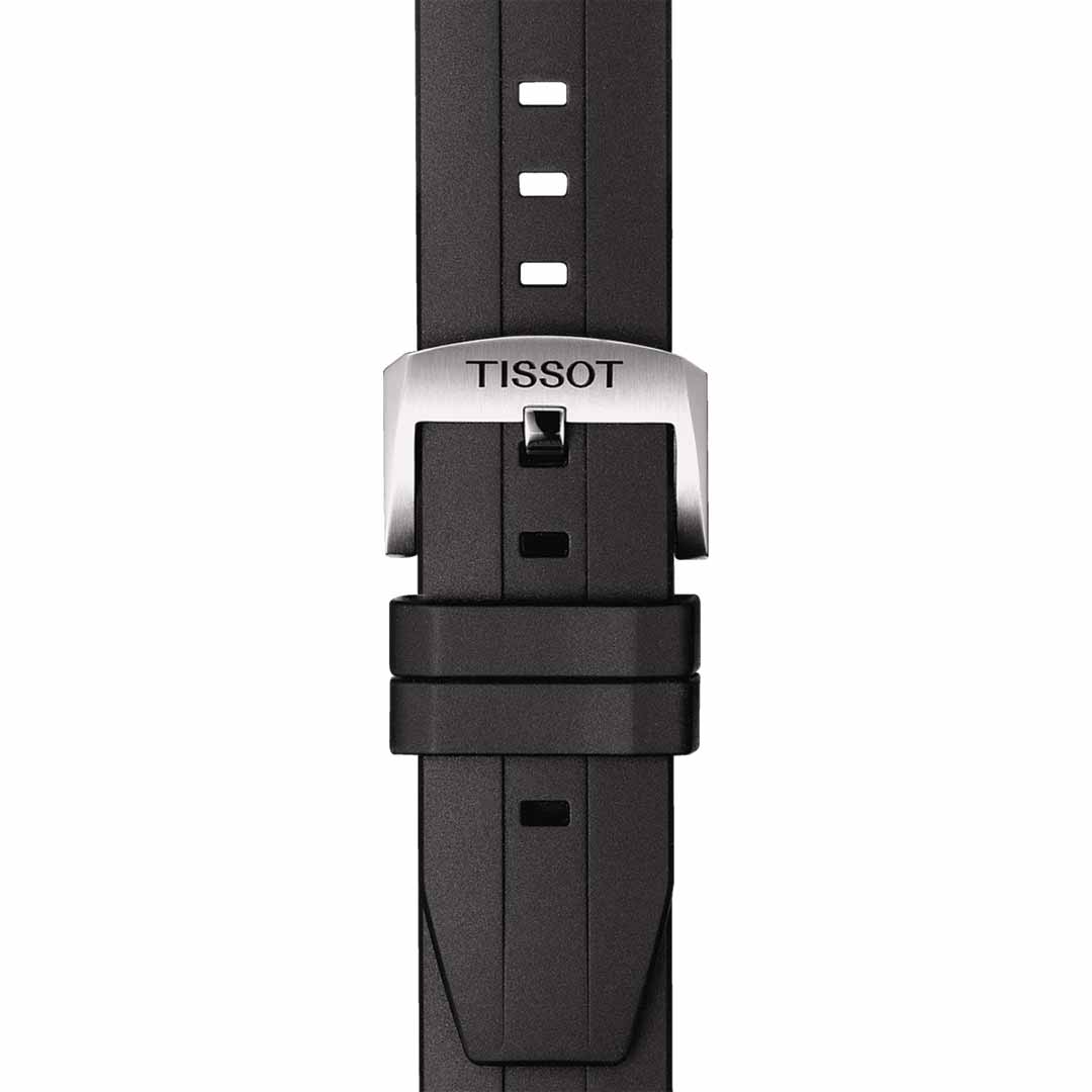 Close-up of a black watch strap with a silver metal buckle showcasing the brand "Tissot." Highlighting the design of the Tissot Seastar 1000 Powermatic 80 Automatic 43mm Watch, the strap includes multiple holes for adjustable sizing.