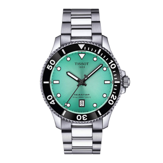 Introducing the Tissot Seastar 1000 Quartz 40mm Watch—a stunning example of Swiss craftsmanship from Tissot. This timepiece features a silver metal band, a striking turquoise dial, black bezel, white markers, and a date display at the 6 o’clock position. With an impressive water resistance of 300m, the Seastar 1000 Quartz combines exceptional style with outstanding functionality.