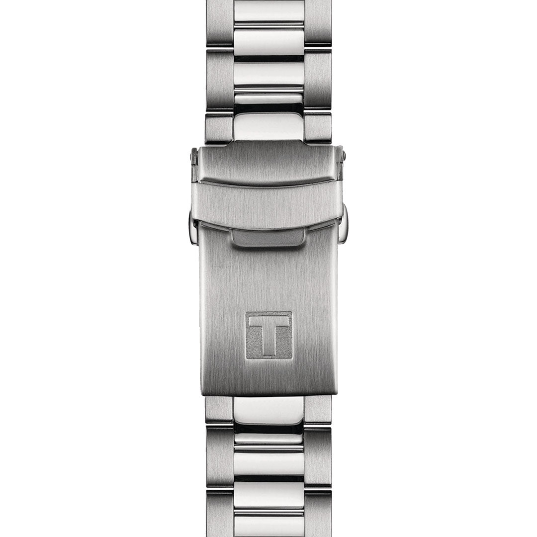 Close-up of the Tissot Seastar 1000 Powermatic 80 Automatic 40mm Watch's stainless steel clasp, accented with a sleek, polished finish. The clasp prominently displays an embossed "T" logo from Tissot. With water resistance up to 100 meters, the highly reflective watchband links epitomize modern and elegant design.