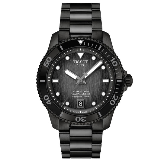 The Tissot Seastar 1000 Powermatic 80 Automatic 40mm Watch features a black dial, white markers, scratch-resistant sapphire crystal, date window at 6 o’clock, and black metal bracelet, shown against a white background.