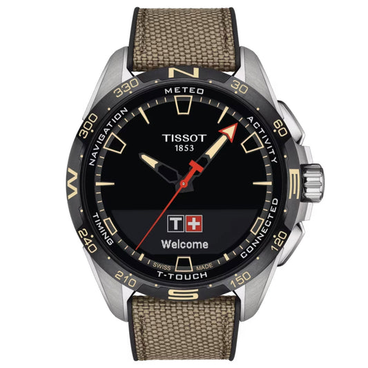 The Tissot T-Touch Connect Solar Quartz 47.5mm Smart Watch features a circular black dial with both analog hands and digital capabilities. It is housed in an antimagnetic titanium case accented by a silver-toned bezel with directional markers. The watch also includes a scratch-resistant sapphire crystal and is paired with a textured fabric strap.