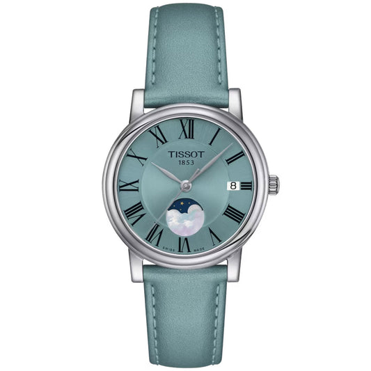 The Tissot Carson Premium Lady Moonphase Quartz 32mm Watch showcases a turquoise dial and leather strap, complete with Roman numerals, a date display, and a moon phase at the 6 o'clock position. It features scratch-resistant sapphire crystal and is powered by precise Swiss quartz movement.