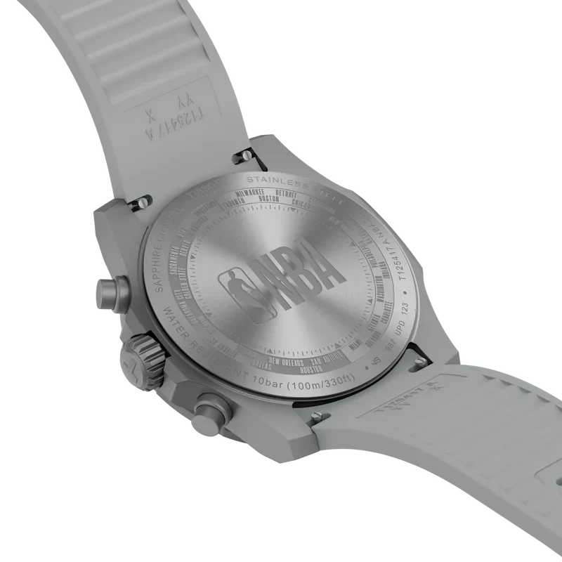 Back view of the Tissot Supersport NBA Edition Chrono Quartz 42mm Watch with a grey silicone strap, showing the NBA logo and team names engraved on the stainless steel case back.