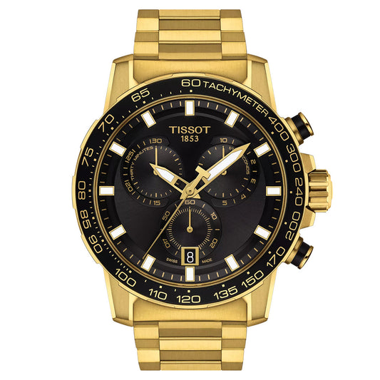 The Tissot Supersport Chrono Quartz 45.5mm Watch features a gold-tone stainless steel case, black dial with three subdials, date at 6 o'clock, gold markers and hands, tachymeter bezel, and precise Swiss quartz movement.