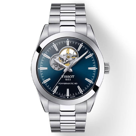 The Tissot Gentleman Powermatic 80 Automatic Open Heart 40mm Watch, crafted by Tissot, boasts a silver metallic design with a blue gradient dial and an open-heart window to display the Swiss Automatic Movement. It includes minimalist hour markers, a stainless steel bracelet, and is protected by durable Sapphire Crystal. The watch proudly features the brand's name alongside "Powermatic 80," highlighting its remarkable 80-hour power reserve.