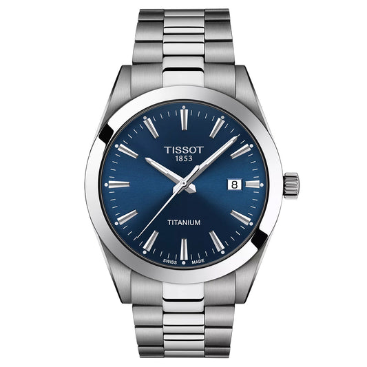 The Tissot Gentleman Titanium Quartz 40mm Watch features a metallic strap, blue dial, silver markers and hands, a date at 3 o'clock, and "TISSOT 1853" and "TITANIUM" on the face. Swiss Quartz movement ensures precision.