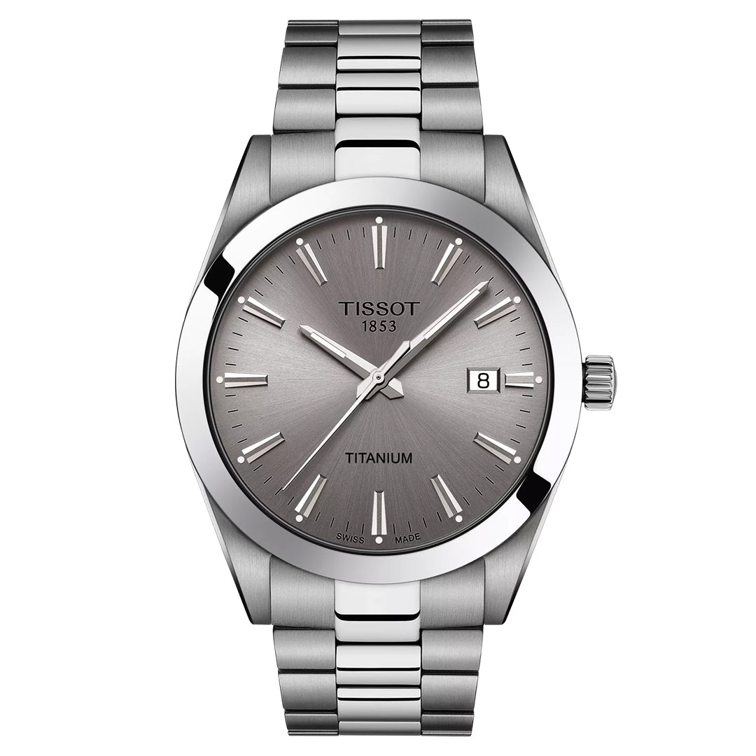 The Tissot Gentleman Titanium Quartz 40mm Watch features a titanium case and bracelet, gray dial with silver markers and hands, Swiss Quartz movement, date at 3 o'clock, and "Tissot 1853" on the upper dial.