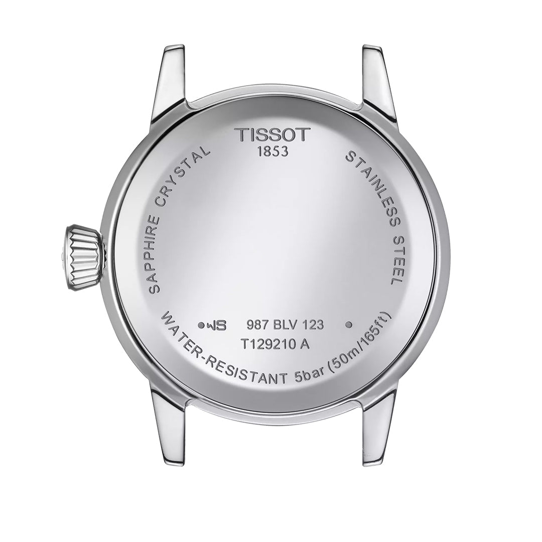 The image showcases the back of a Tissot Classic Dream Lady Quartz 28mm Watch, highlighting its sophistication with engraved details such as "Sapphire Crystal," "Stainless Steel," and "Water-Resistant 5 bar (50m/165ft)." The silver case, featuring lugs and a crown on the left side, captures timeless elegance.