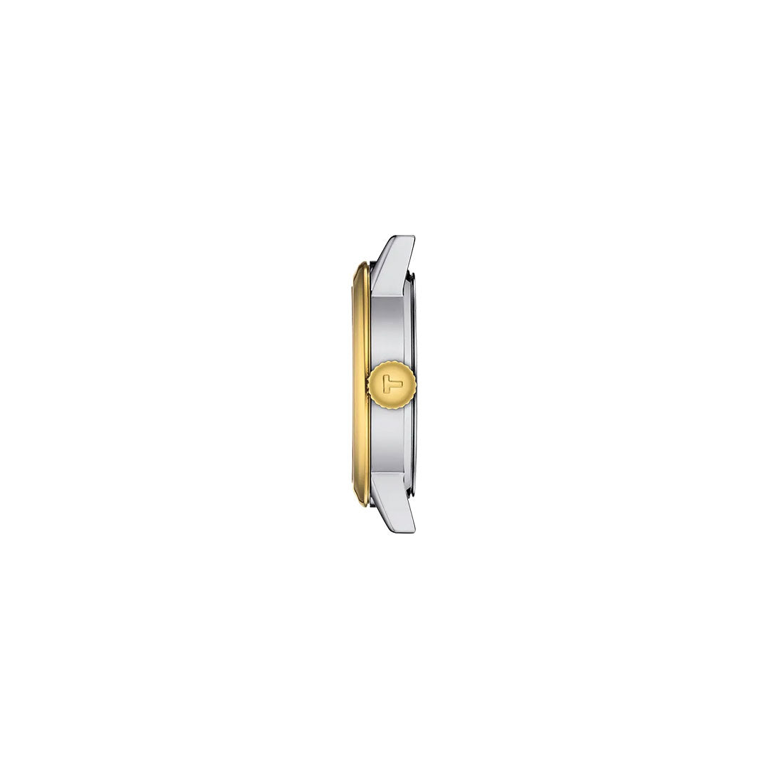 Side view of the Tissot Classic Dream Quartz 28mm Watch showing its round gold bezel, silver stainless steel case, and gold-toned crown with an engraved "T" logo—an elegant Tissot timepiece set against a plain white background.