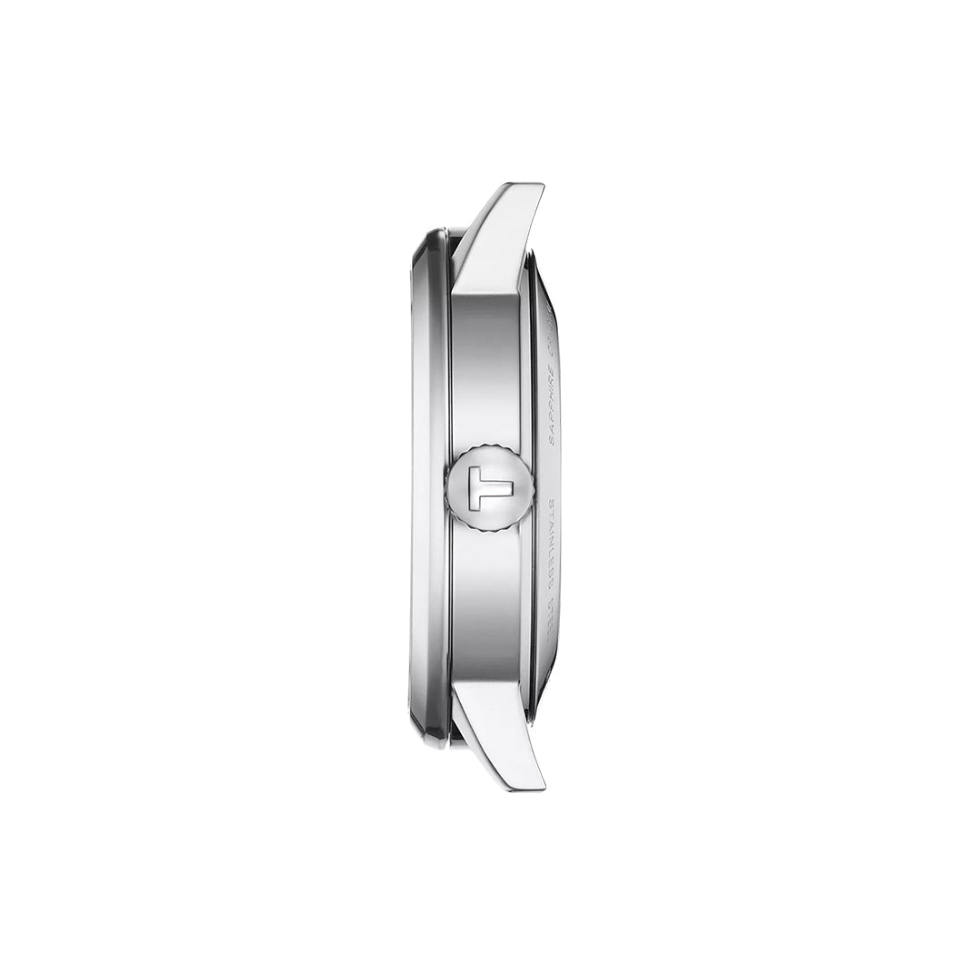 Side view of the Tissot Classic Dream Swissmatic 42mm Watch, featuring a silver stainless steel case, round crown, and two visible lugs, displayed against a plain white background.
