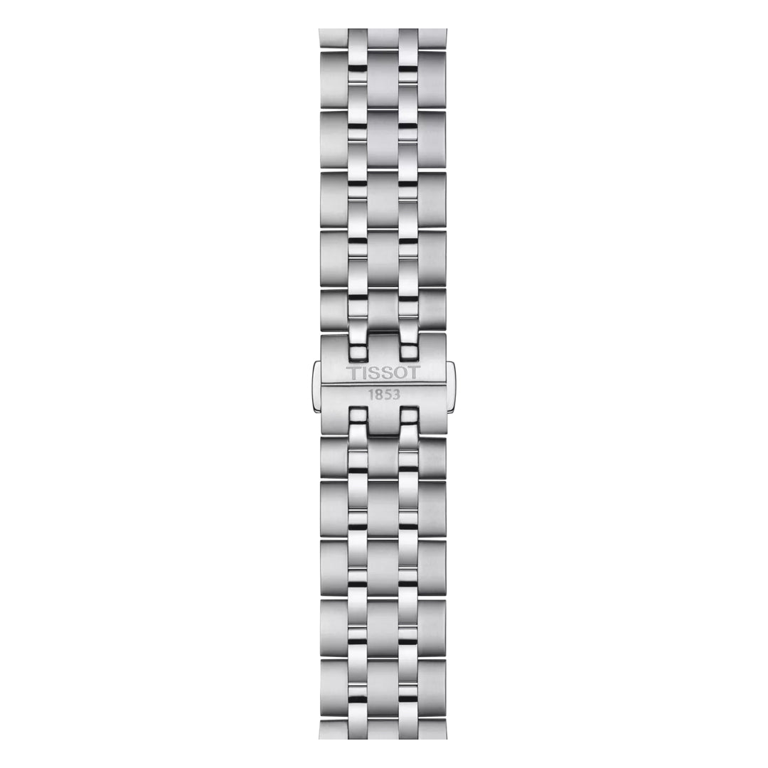 The Tissot Classic Dream Swissmatic 42mm Watch features a stainless steel five-link bracelet, polished and brushed, with a "TISSOT 1853" engraved clasp, shown vertically next to its stainless steel case on a white background.