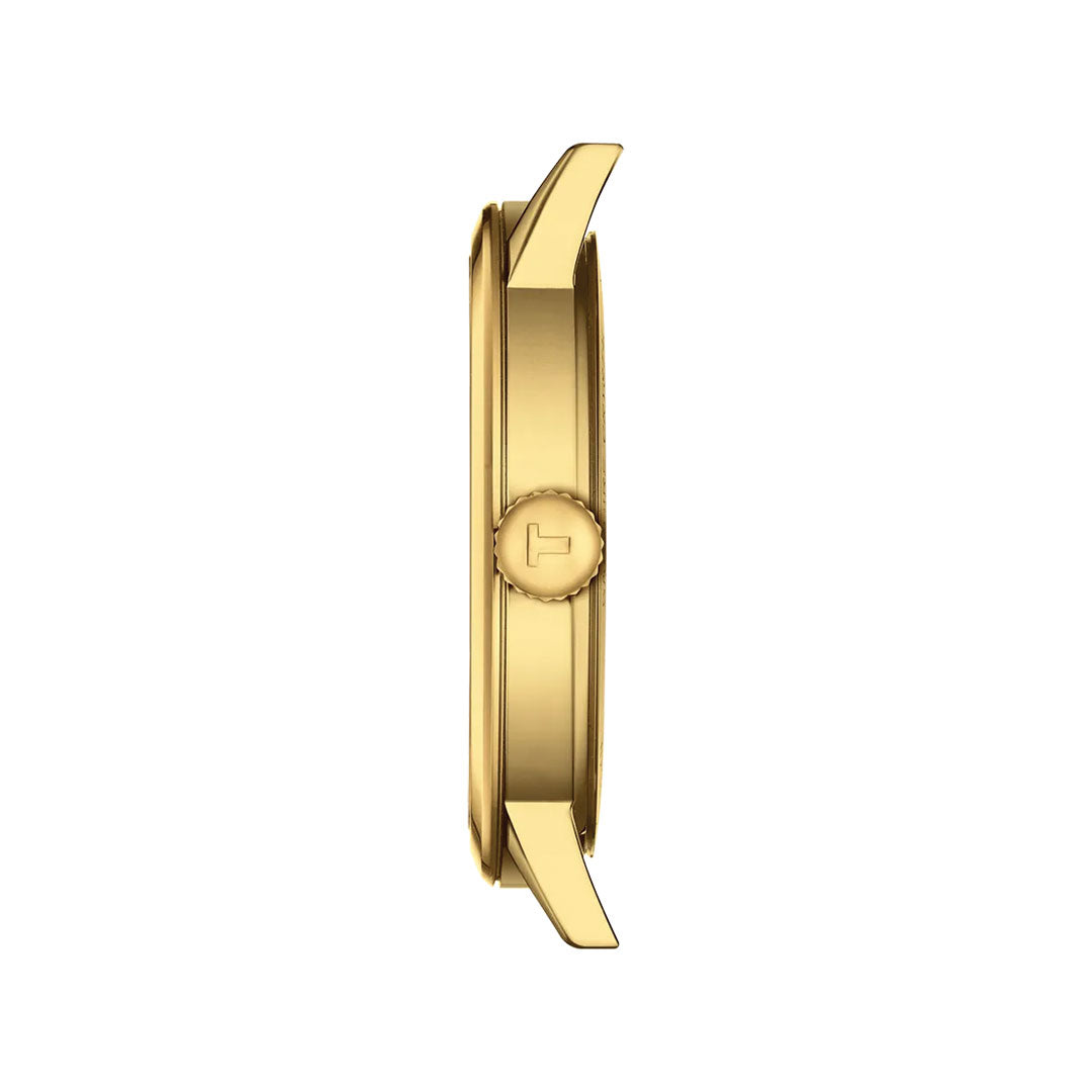 Side view of the Tissot Classic Dream Quartz 42mm Watch featuring a gold case, round crown with "T" logo, and minimal design. Shown on a white background, this Tissot watch supports an interchangeable quick release bracelet.