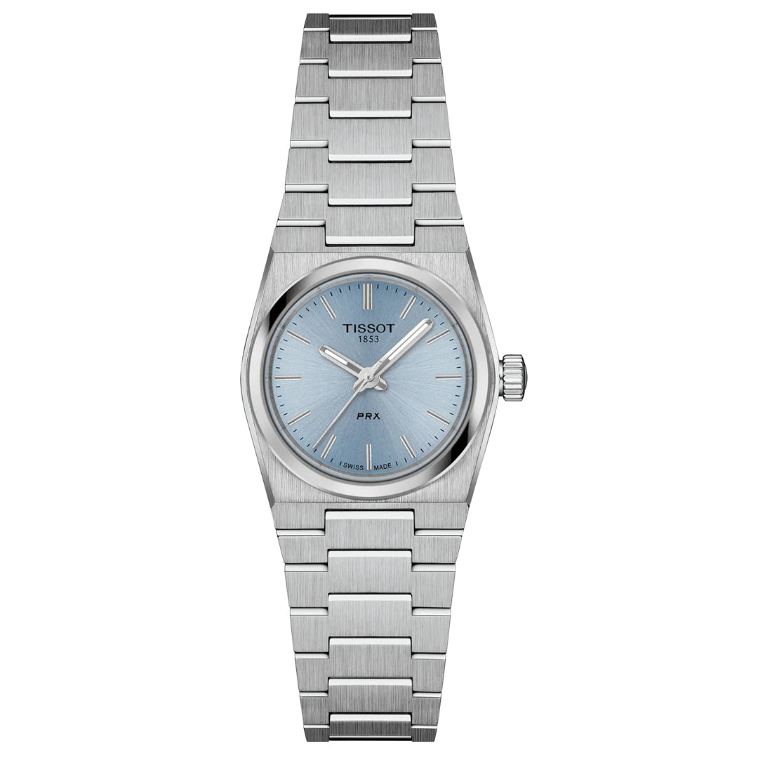 The Tissot PRX Quartz 25mm Watch features a stainless steel case, light blue dial with silver hour markers, date at 3 o’clock, sapphire crystal, and a minimalist metal link bracelet for a sleek, modern look.