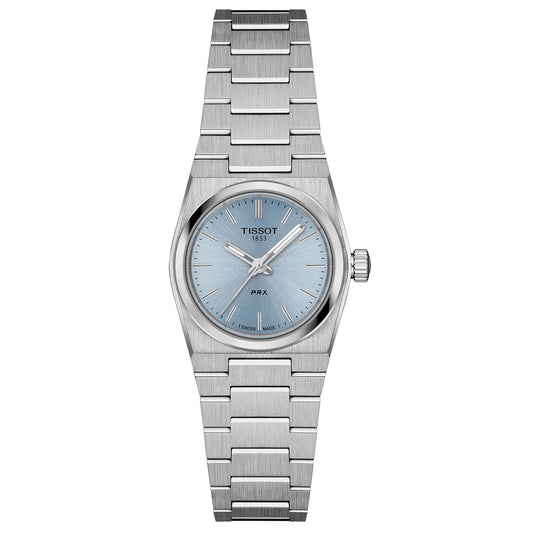 The Tissot PRX Quartz 25mm Watch features a stainless steel case, light blue dial with silver hour markers, date at 3 o’clock, sapphire crystal, and a minimalist metal link bracelet for a sleek, modern look.
