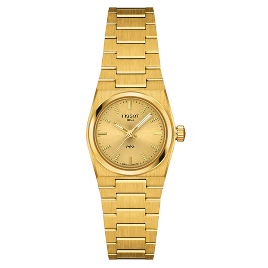 The Tissot PRX Quartz 25mm Watch features a round gold dial with gold markers and hands, "Tissot 1853" and "PRX" on the minimal face, plus a matching gold bracelet for an elegant stainless steel style.