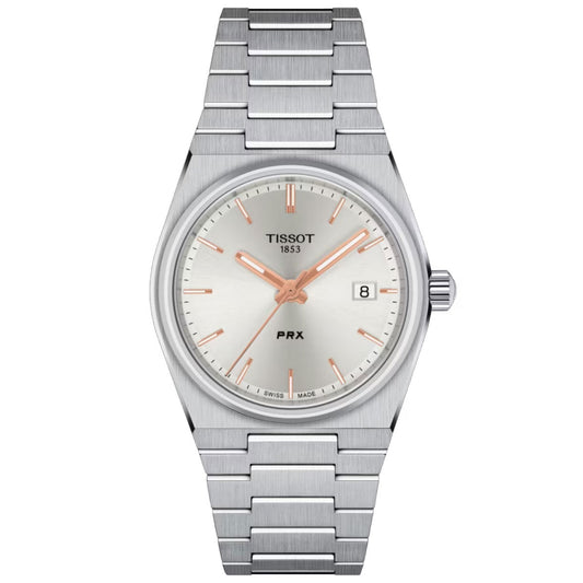 Introducing the Tissot PRX Quartz 35mm Watch: This exquisite timepiece from Tissot features a 316L stainless steel case and bracelet in a sleek silver finish. The watch showcases a white dial adorned with silver hour markers and hands, complete with a date window at the 3 o'clock position and the iconic Tissot logo at 12 o'clock. A scratch-resistant sapphire crystal offers enhanced durability.