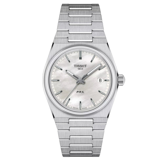 The Tissot PRX Quartz 35mm Watch features a stainless steel band, a white dial with silver hour markers and date window at 3 o’clock, Swiss Quartz movement, and the “Tissot 1853” branding below 12 o’clock.