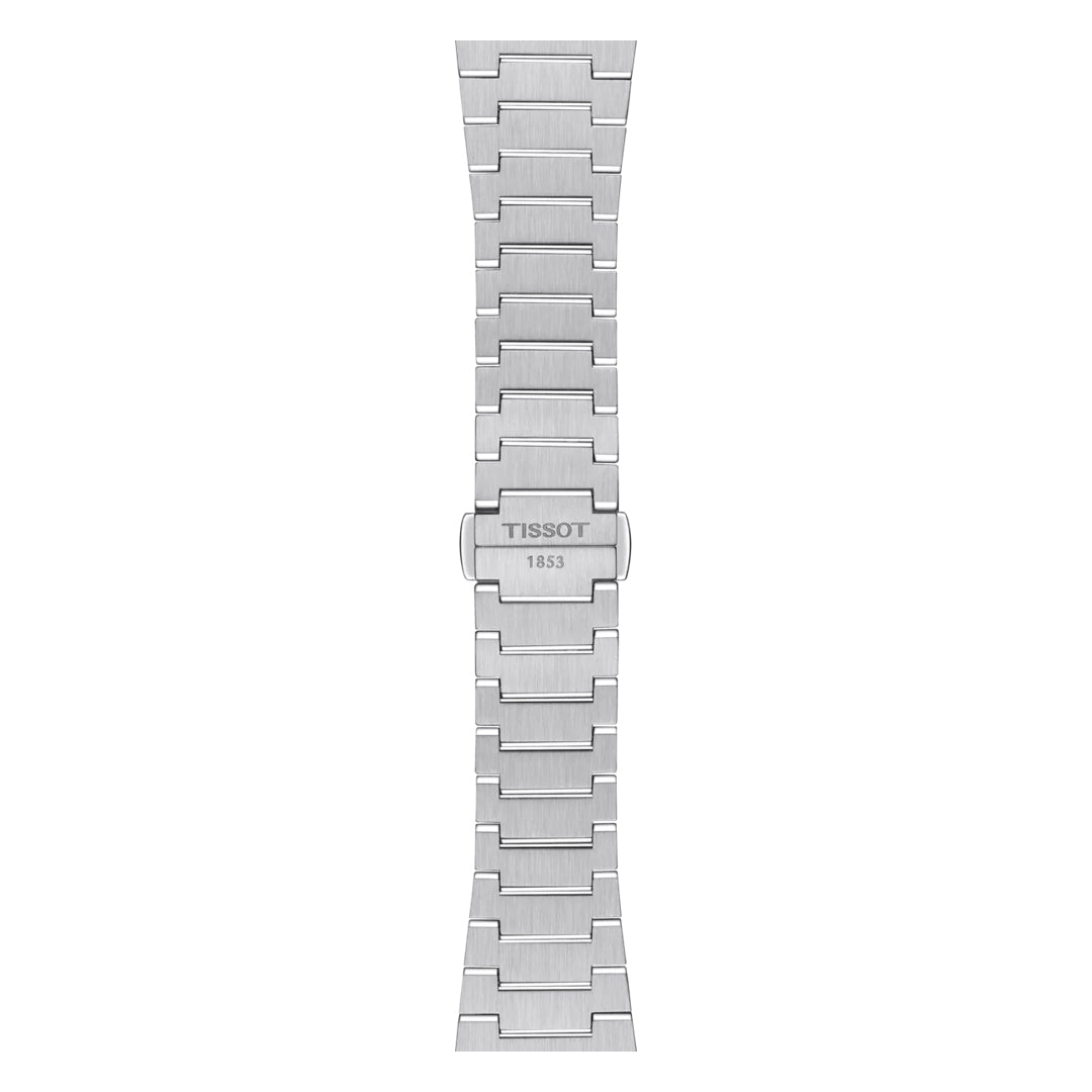 The Tissot PRX Quartz 35mm Watch features a silver stainless steel bracelet with a brushed finish, geometric links, and a butterfly clasp engraved "TISSOT 1853," reflecting the retro style of this iconic Swiss timepiece.