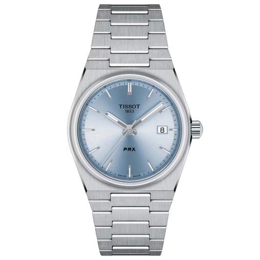 A Tissot PRX Quartz 35mm Watch with a stainless steel band. It boasts a light blue dial complemented by silver hour markers and hands, all safeguarded by sapphire crystal. The date is conveniently displayed at 3 o'clock, with the Tissot brand name and "1853" elegantly positioned at 12 o'clock. Its Swiss quartz movement guarantees precision.