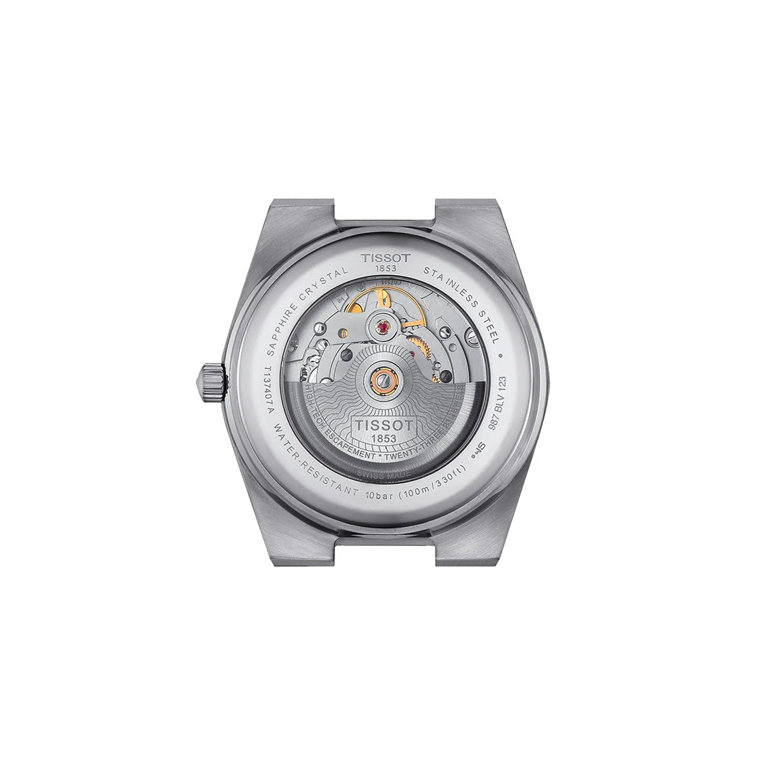 Back view of the Tissot PRX Powermatic 80 Automatic 40mm Watch showcasing its visible movement with a Nivachron hairspring, labeled components, and engraved details on the stainless steel case—including the Tissot brand name, water resistance, and sapphire crystal.