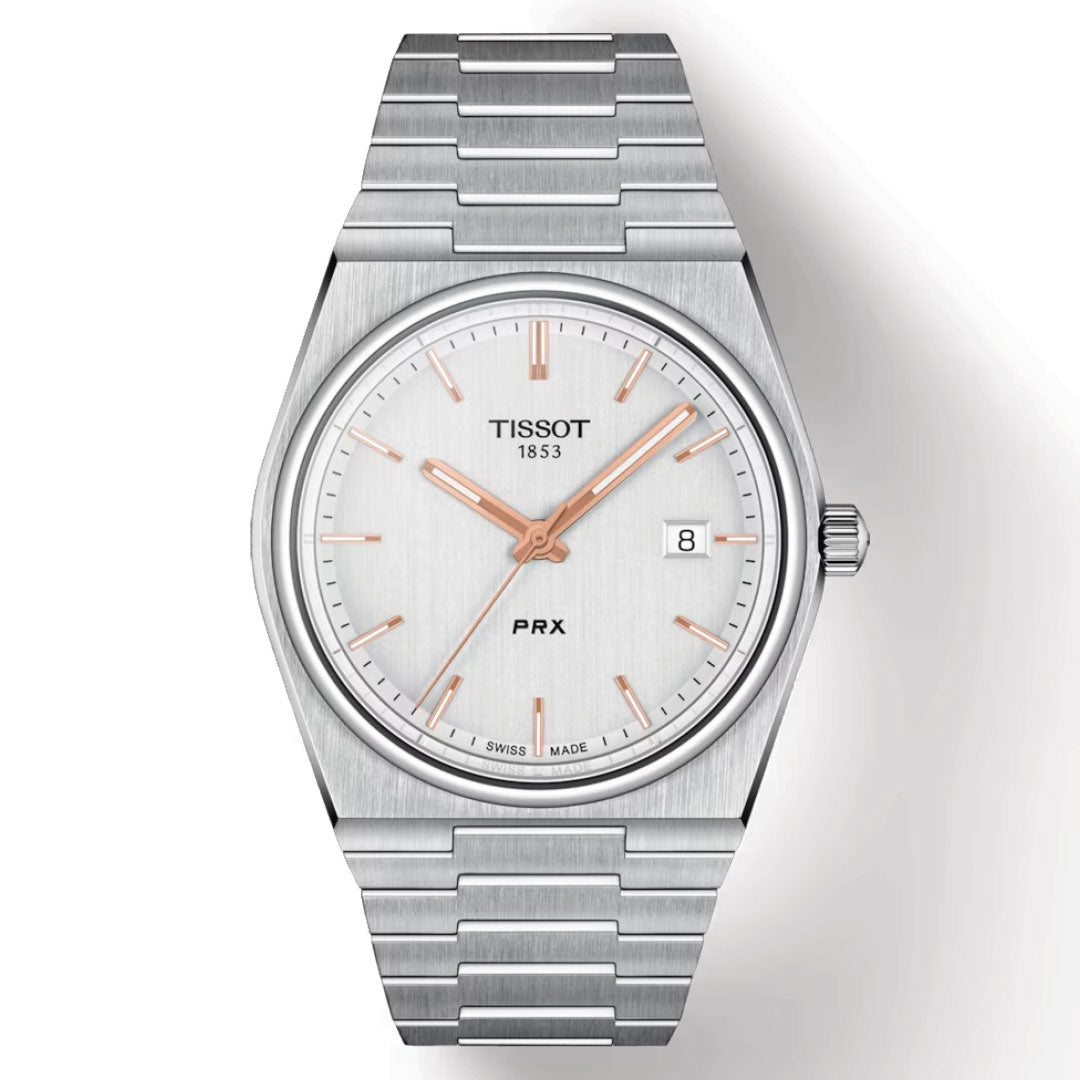 The Tissot PRX Quartz 35mm Watch features precise Swiss Quartz movement and a stainless steel case with a silver dial. Its rose gold hour markers and hands are protected by a scratch-resistant sapphire crystal, highlighting the date display at 3 o'clock, while the stylish metal bracelet enhances its elegance.