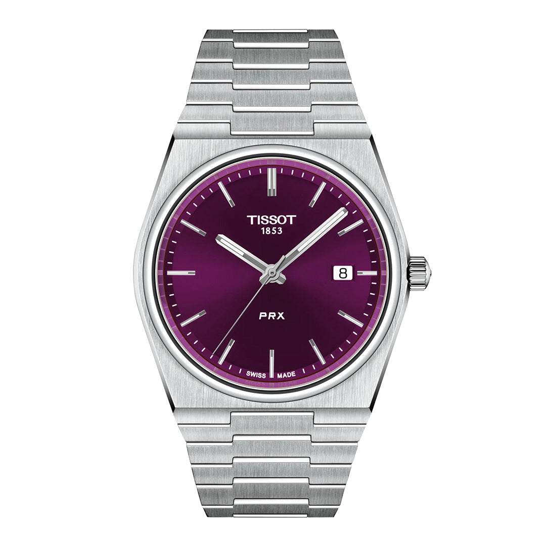 The Tissot PRX Quartz 40mm Watch features a sleek metallic band and a striking purple dial with silver hour markers, a date window at 3 o’clock, and the Tissot logo at 12 o’clock. Inspired by the iconic 1978 case design, this timeless piece is elegantly offered by Raffi Jewellers.
