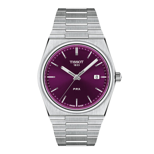 The Tissot PRX Quartz 40mm Watch features a sleek metallic band and a striking purple dial with silver hour markers, a date window at 3 o’clock, and the Tissot logo at 12 o’clock. Inspired by the iconic 1978 case design, this timeless piece is elegantly offered by Raffi Jewellers.