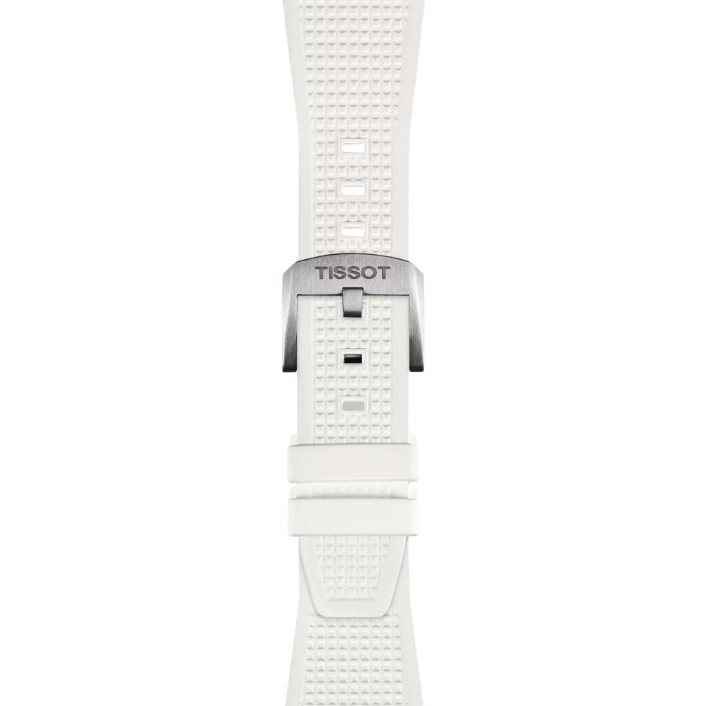 The Tissot PRX Quartz 40mm Watch features a slim white textured strap with a "TISSOT" engraved metallic buckle. With adjustment holes and a loop for securing extra length, it elegantly blends modern-vintage style with functionality.