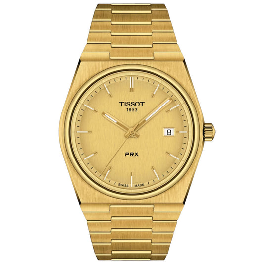The Tissot PRX Quartz 40mm Watch showcases a yellow gold PVD case with a metallic gold dial, complemented by gold hour markers and a date display at 3 o'clock. This elegant timepiece features Swiss Quartz Movement and is protected by Scratch Resistant Sapphire Crystal, completed with a matching polished gold bracelet.