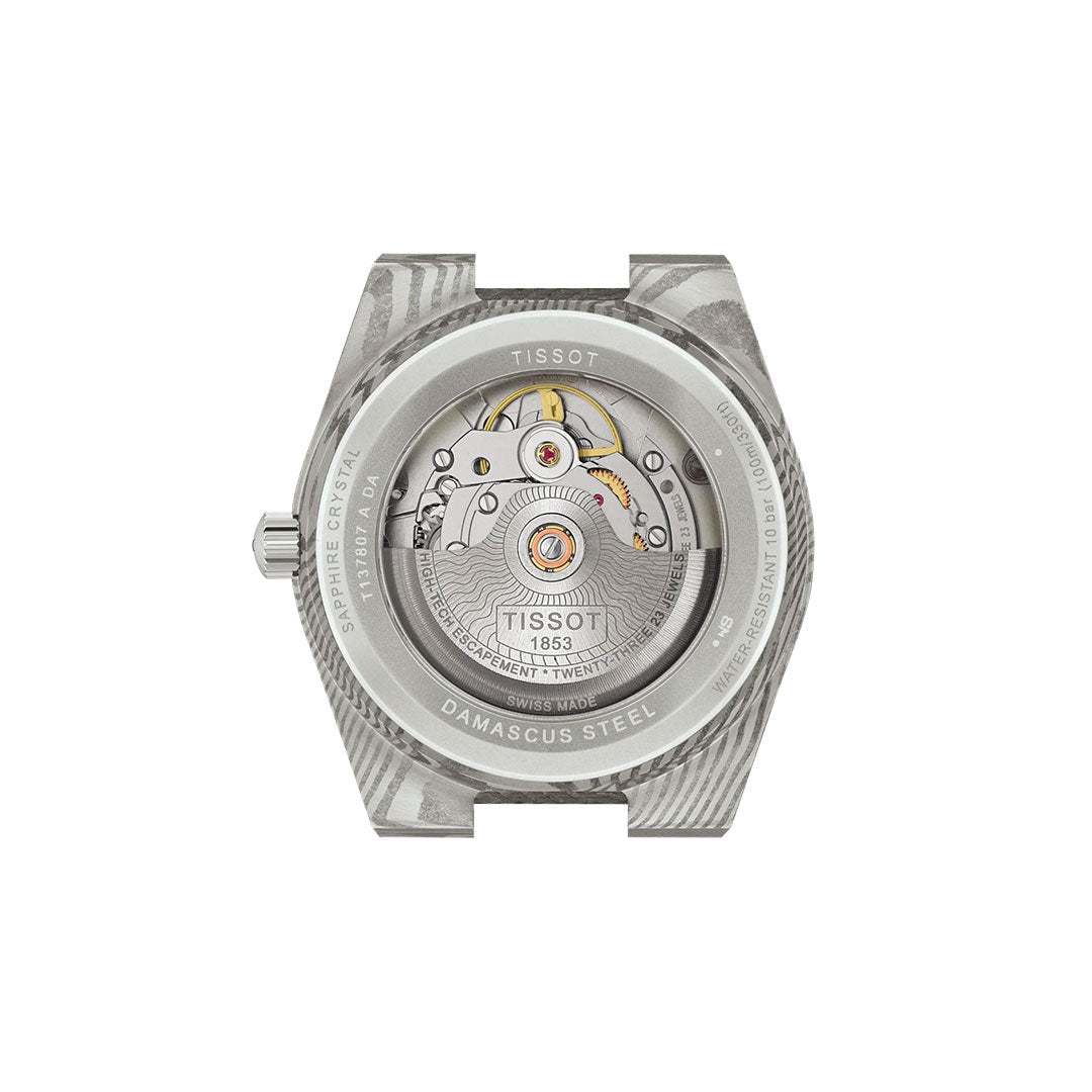 Back view of the Tissot PRX Damascus Steel Powermatic 80 Automatic 38mm Watch, highlighting the exposed mechanical movement and intricate gears through its transparent case back, with "TISSOT 1863" visible on the mechanism.