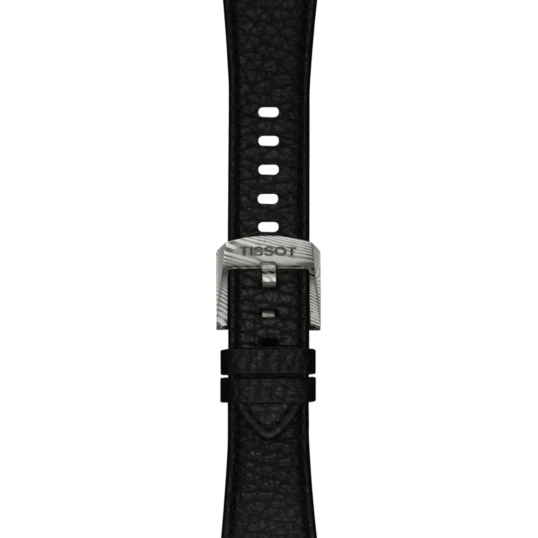 Black textured watch strap with a silver engraved "Tissot" buckle, featuring multiple adjustment holes, shown vertically on white. Perfectly pairs with the Tissot PRX Damascus Steel Powermatic 80 Automatic 38mm Watch.