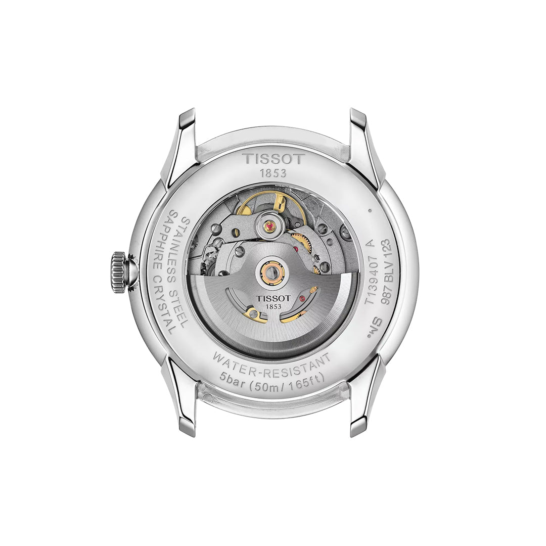 Close-up of the Tissot Chemin Des Tourelles Powermatic 80 Automatic 42mm Watch’s transparent caseback, showcasing its inner movement and 80-hour power reserve, plus engravings for stainless steel, sapphire crystal, and water resistance.