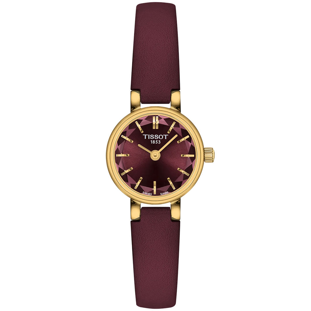 The Tissot Lovely Round Quartz 19.5mm features a gold-tone case, burgundy dial with gold markers, and matching burgundy leather strap. "Tissot 1853" graces the scratch-resistant sapphire glass face for an elegant touch.