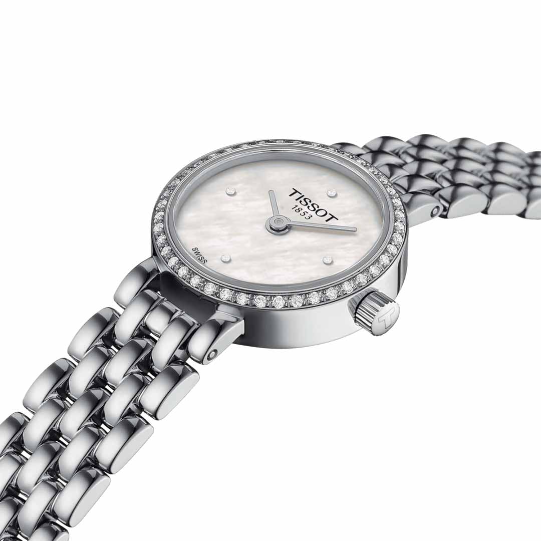 The Tissot Lovely Round Quartz 19.5mm Watch features a round face and a stainless steel link bracelet. It presents an elegant mother-of-pearl dial, diamond-embedded bezel, and thin silver hands, offering a luxurious look with Swiss Quartz movement and scratch-resistant sapphire crystal.