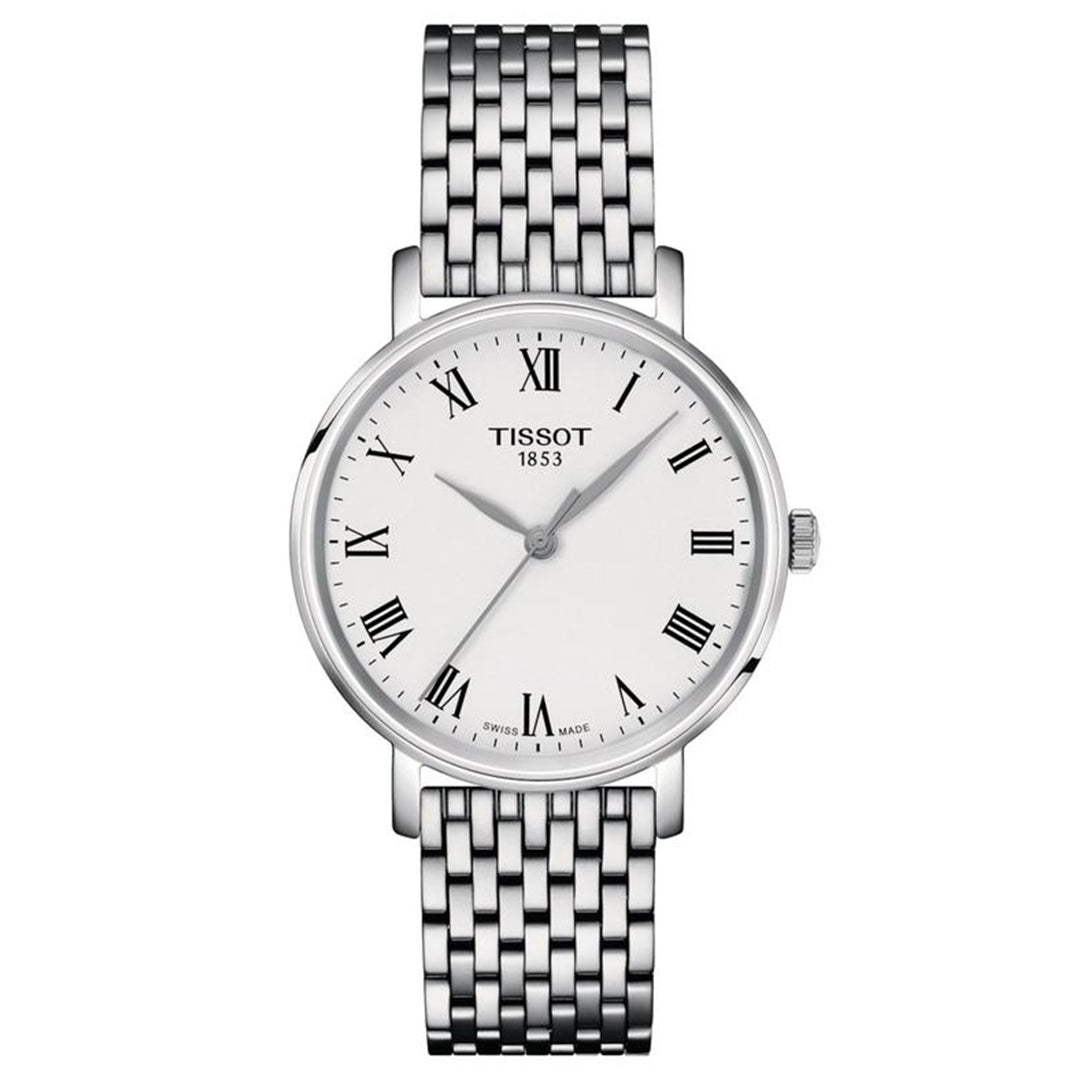 The Tissot Everytime Quartz 34mm is a silver women's watch with a white dial, Roman numerals, three hands, metal link bracelet, and the "TISSOT 1853" logo. The face also displays "Swiss Made.