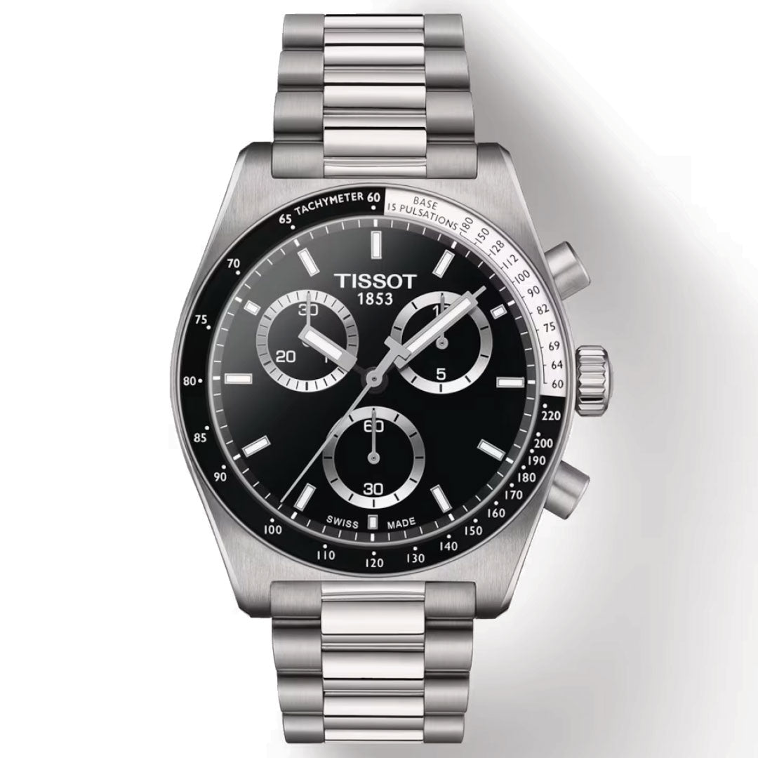 A Tissot PR516 Chronograph Quartz 40mm Watch with a stainless steel band and black dial is displayed. It includes three subdials, a tachymeter scale, and a date window, all powered by precise quartz movement. The brand "Tissot" along with the year "1853" is prominently featured on the face.