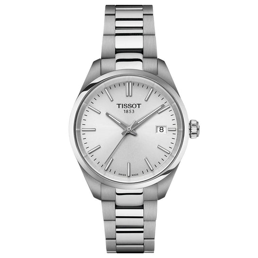The Tissot PR100 Quartz 34mm Watch features a stainless steel case and bracelet, minimalist white dial with silver markers and hands, date at 3 o'clock, and the Tissot logo with "1853" below. Modern silver design by Tissot.