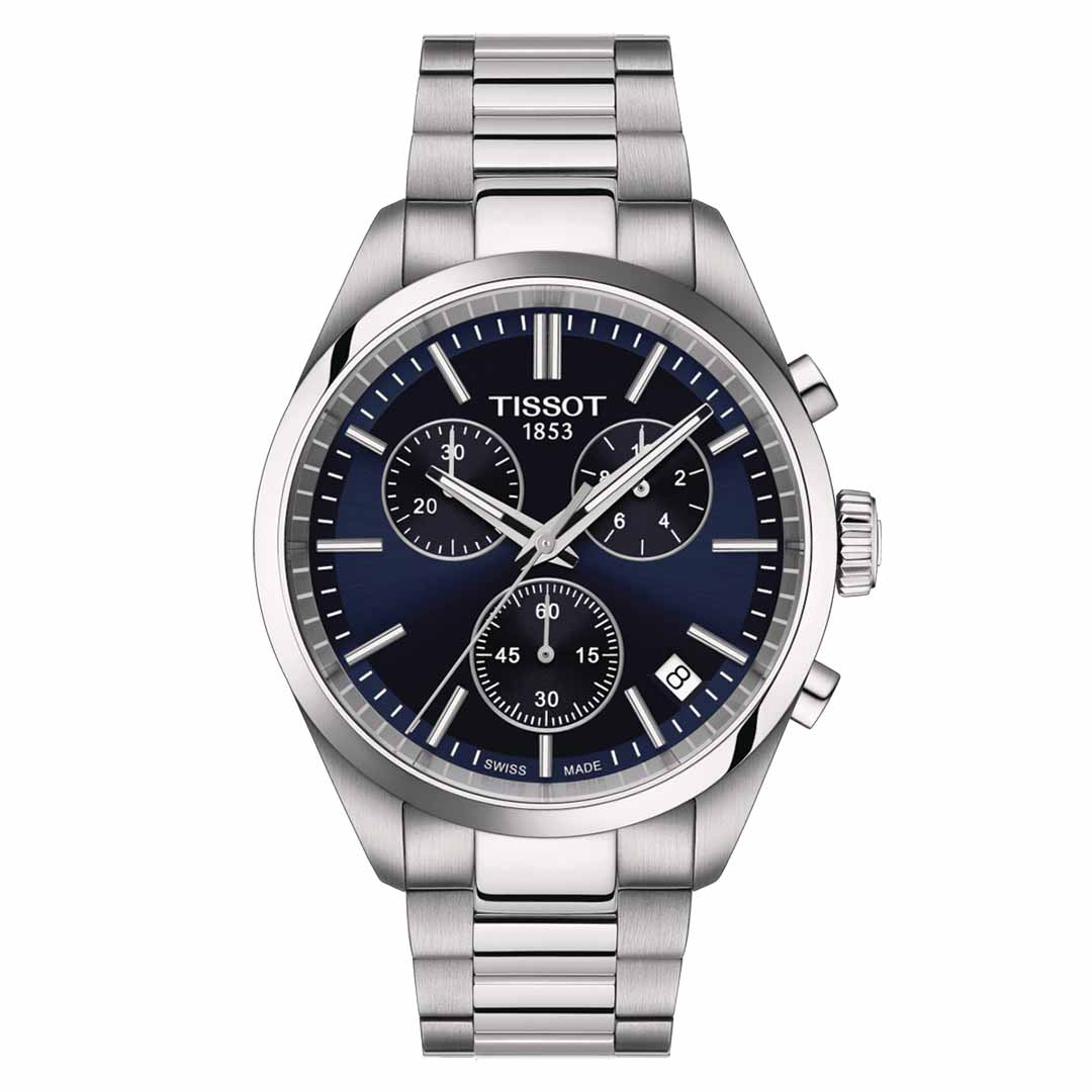 A Tissot PR100 Chronograph Quartz 40mm Watch in silver, featuring a blue face with three subdials and a date window. This elegant quartz chronograph comes with a stainless steel band, Super-LumiNova® coating for enhanced visibility, and proudly displays "Tissot 1853" on the dial.