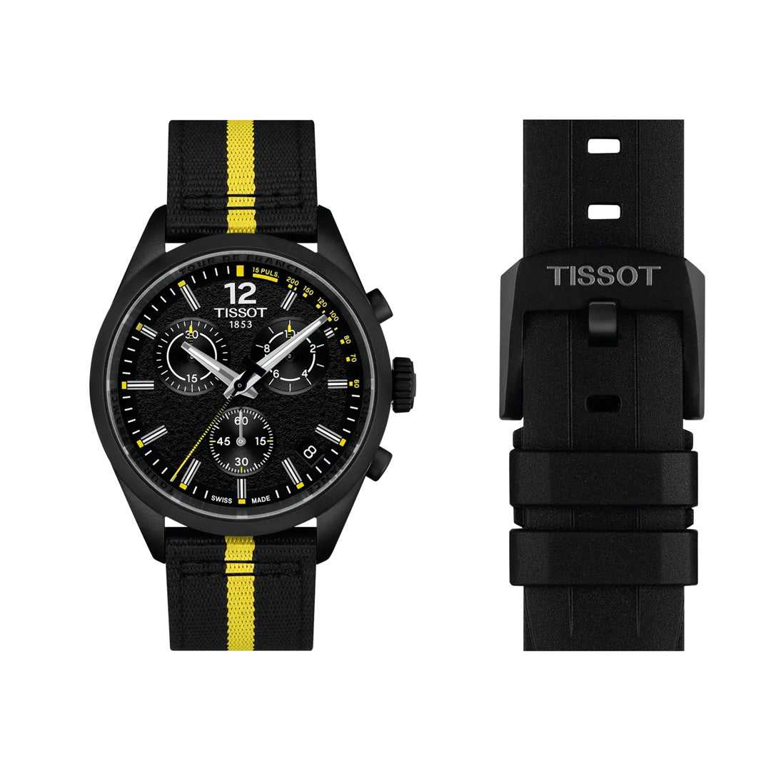A black Tissot PR100 Chronograph Tour De France 2026 Quartz 40mm Watch, featuring a striking yellow racing stripe on the strap, is displayed next to its matching black buckle. This bold timepiece by Tissot showcases multiple dials and vibrant yellow accents on both the face and strap, making it an ideal choice for Tour de France enthusiasts.