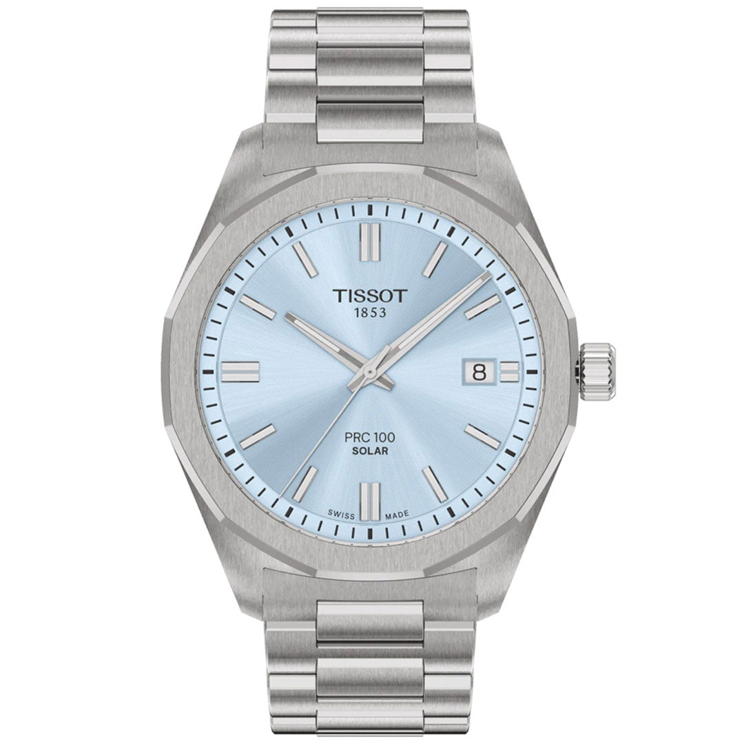 The Tissot PRC 100 Solar Quartz 39mm Watch features a silver metal band, light blue dial, silver hour markers, date window at 3 o’clock, and “Tissot 1853 PRC 100 Solar” on the face—a stylish solar-powered timepiece for any occasion.