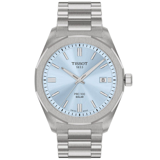 The Tissot PRC 100 Solar Quartz 39mm Watch features a silver metal band, light blue dial, silver hour markers, date window at 3 o’clock, and “Tissot 1853 PRC 100 Solar” on the face—a stylish solar-powered timepiece for any occasion.