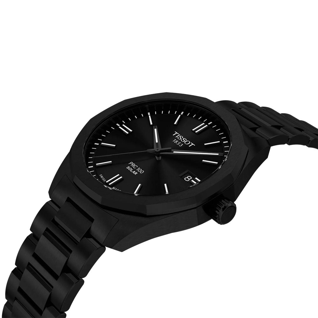 The Tissot PRC 100 Solar Quartz 39mm Watch by Tissot features a black dial, white hour markers, date display at 3 o’clock, and a metal link band. Shown angled on a white background.