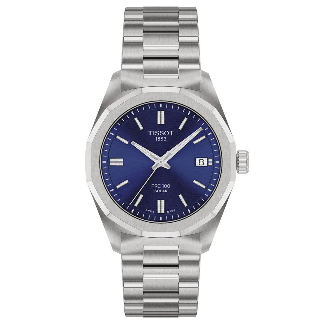 The Tissot PRC 100 Solar Quartz 34mm Watch features a stainless steel case, blue dial with silver markers and hands, date at 3 o’clock, “Tissot 1853” on the face, metal link band, and advanced solar-powered technology.