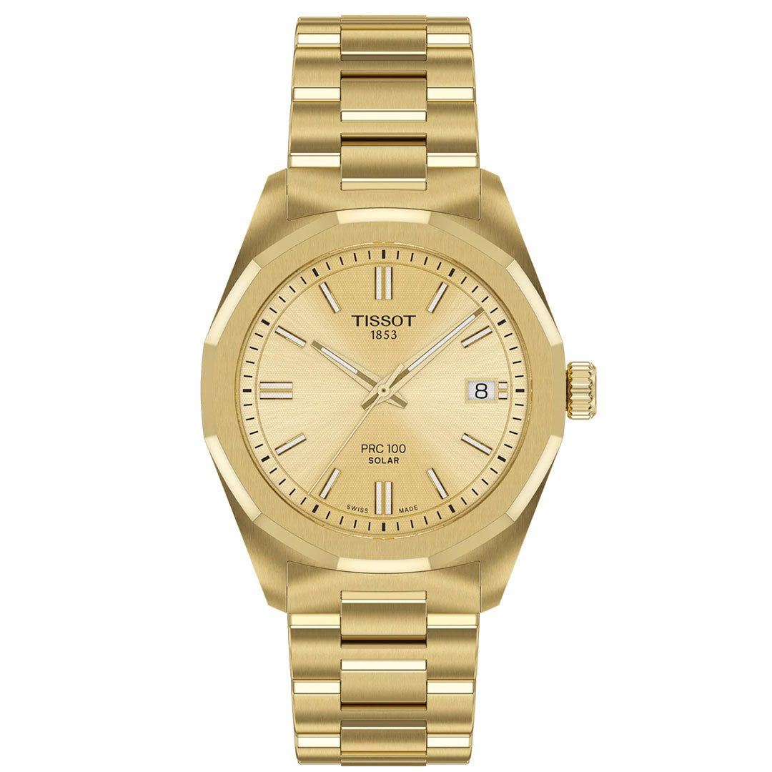 The Tissot PRC 100 Solar Quartz 34mm watch features a gold metal band, minimalist dial with baton markers, date at 3 o’clock, and Tissot 1853 branding—a stylish and eco-friendly solar-powered timepiece.